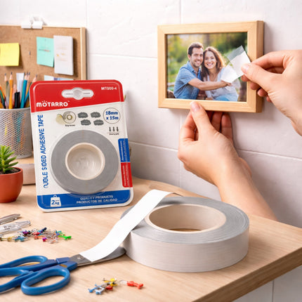 Person using adhesive tape to remove a photo from a wall, with Motarro tape packaging visible.