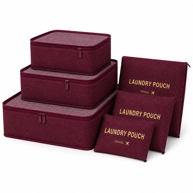 A set of burgundy fabric travel organizers and pouches with gold lettering, including three rectangular zippered boxes, two flat pouches, and one zippered laundry pouch, arranged on a white background.