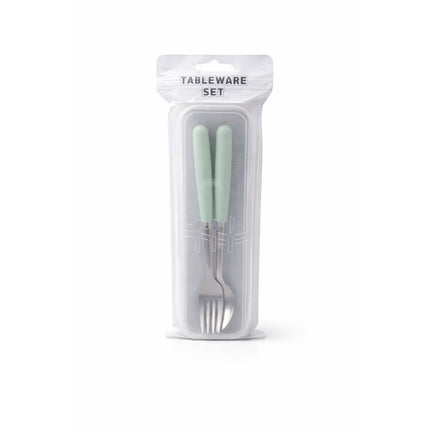 Tableware set with light green handles in clear packaging on a white background