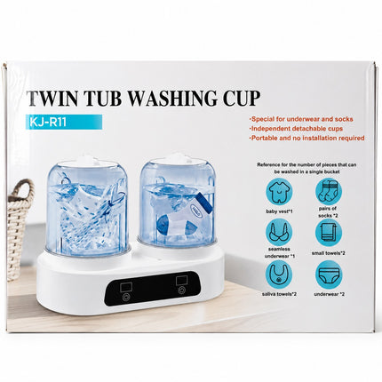 A twin tub washing cup product box on a white background. The packaging shows two transparent blue tubs with baby items inside and a white base with a black control panel.