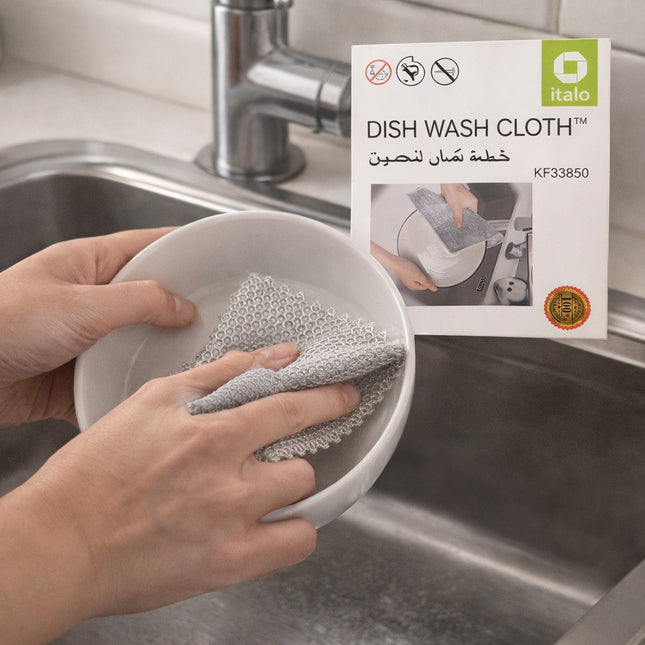 Person cleaning a bowl with a dish wash cloth next to italo dish wash cloth packaging.