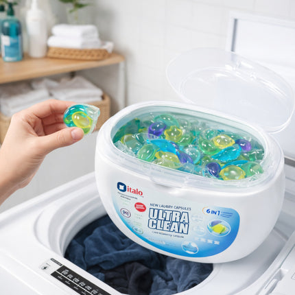 Dialo Ultra Clean laundry detergent with a container and a capsule held by a hand, set against a washing machine background.