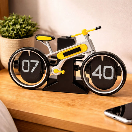 Bicycle-shaped clock with digital display on a wooden surface