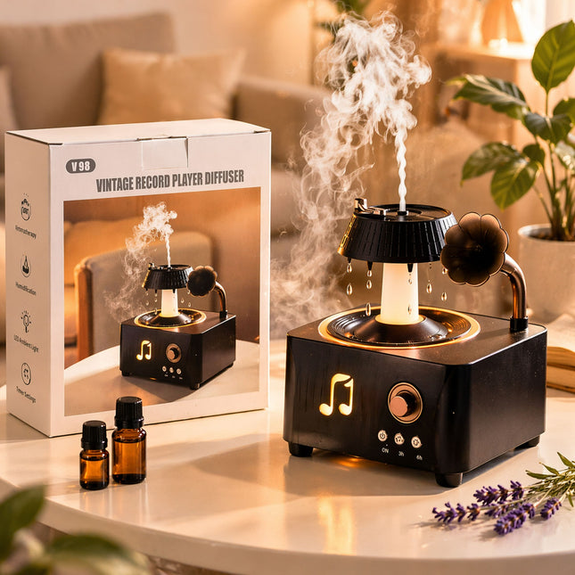 Vintage record player diffuser with essential oils and packaging on a table.