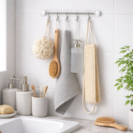 Bathroom with various cleaning tools and accessories hanging on a rack.