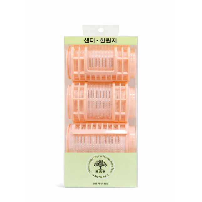 Pack of hair rollers with a green label on a white background