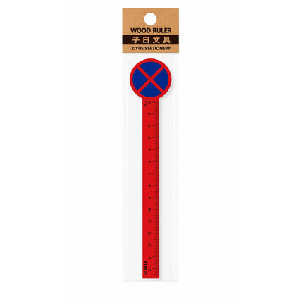 Red wooden ruler with blue circle and red cross on a white background