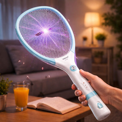 Hand holding a fly swatter with a glowing purple light, used to kill mosquitoes, in a home setting.